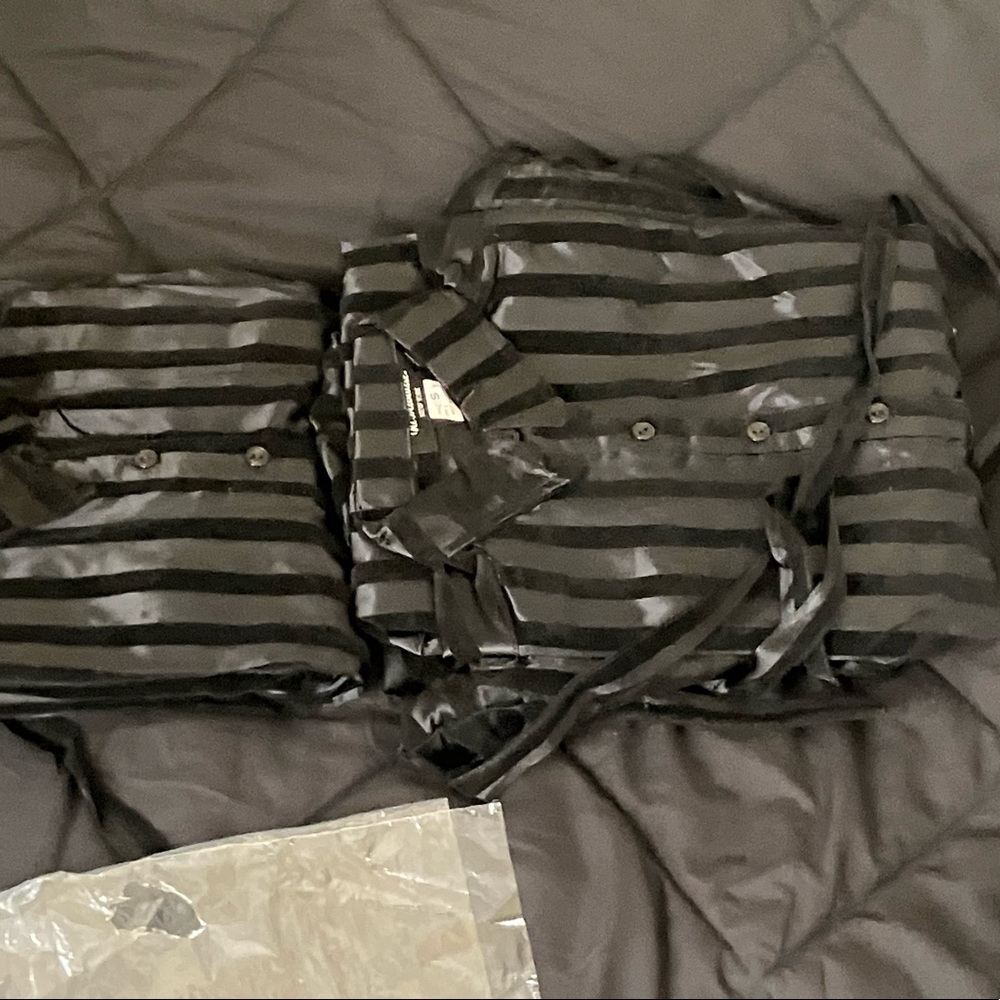 100% polyester two toned black striped shirt dresses.